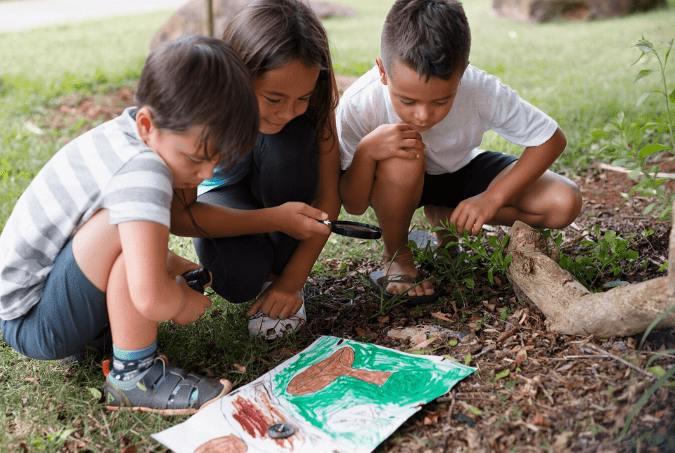 Children participating in an outdoor scavenger hunt